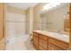 Bathroom featuring double sinks, vanity, bathtub and shower combo at 16231 Rayburn St, Hudson, CO 80642