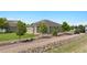 Charming single story home with well-manicured landscaping and neutral colored exterior at 16231 Rayburn St, Hudson, CO 80642