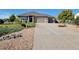 Beautiful single-story home with a well-maintained front yard, a long driveway and a two car garage at 16231 Rayburn St, Hudson, CO 80642