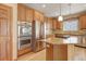 Well-equipped kitchen with stainless steel appliances, granite countertops, and ample cabinet space at 16231 Rayburn St, Hudson, CO 80642