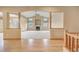 Bright living room with vaulted ceilings, fireplace, and seamless flow to the dining area at 16231 Rayburn St, Hudson, CO 80642