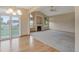 Spacious living room with fireplace, large windows, and a seamless transition from the dining area at 16231 Rayburn St, Hudson, CO 80642