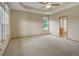 Spacious main bedroom with tray ceiling, plush carpet, and abundant natural light from multiple windows at 16231 Rayburn St, Hudson, CO 80642