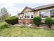 A charming backyard features a well-maintained lawn, mature landscaping, and a cozy patio area for relaxation at 6193 Terry Ct, Arvada, CO 80403