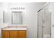Bathroom featuring a vanity with a sink and a shower with glass doors at 6193 Terry Ct, Arvada, CO 80403