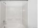 A clean and well-maintained bathtub and shower combination at 6193 Terry Ct, Arvada, CO 80403