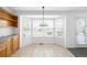 Charming breakfast nook features a bay window and tiled floor, perfect for casual dining at 6193 Terry Ct, Arvada, CO 80403