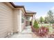 Charming front porch with brick pillars and beautiful landscaping at 6193 Terry Ct, Arvada, CO 80403