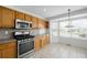 Functional kitchen featuring stainless steel appliances and ample counter space at 6193 Terry Ct, Arvada, CO 80403
