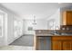 The kitchen offers a stainless steel dishwasher, wood cabinets, and an eat-in breakfast area at 6193 Terry Ct, Arvada, CO 80403