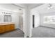Bright and spacious main bedroom and bathroom featuring plush carpet and vaulted ceilings at 6193 Terry Ct, Arvada, CO 80403