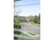 A charming street view showcases lush landscaping, mature trees, and well-maintained homes in a desirable neighborhood at 6193 Terry Ct, Arvada, CO 80403