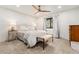 Bright and airy bedroom with natural light, a ceiling fan, and neutral decor at 6640 Kilimanjaro Dr, Evergreen, CO 80439