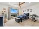 Cozy bedroom with mountain views, telescope, and a ceiling fan at 6640 Kilimanjaro Dr, Evergreen, CO 80439