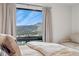 Bright bedroom view of mountains at 6640 Kilimanjaro Dr, Evergreen, CO 80439