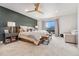 Cozy bedroom featuring plush carpet, decorative pillows, and ample natural light at 6640 Kilimanjaro Dr, Evergreen, CO 80439