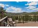 Scenic mountain views from outdoor deck seating area at 6640 Kilimanjaro Dr, Evergreen, CO 80439