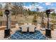 Outdoor deck with dining table and patio heaters at 6640 Kilimanjaro Dr, Evergreen, CO 80439