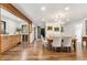 Cozy dining area complemented with a wet bar and modern lighting fixtures at 6640 Kilimanjaro Dr, Evergreen, CO 80439