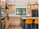 Well-equipped kitchen with updated appliances and a view of the natural surroundings at 6640 Kilimanjaro Dr, Evergreen, CO 80439