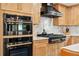 This kitchen features a ZLINE oven, microwave, and range with a black stainless steel finish and gold accents at 6640 Kilimanjaro Dr, Evergreen, CO 80439