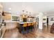 Spacious kitchen with a center island, modern appliances, and elegant lighting fixtures at 6640 Kilimanjaro Dr, Evergreen, CO 80439