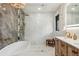 Modern main bathroom featuring a soaking tub, glass enclosed shower, and wood vanity at 6640 Kilimanjaro Dr, Evergreen, CO 80439