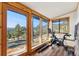 Bright sunroom with scenic views and exercise equipment at 6640 Kilimanjaro Dr, Evergreen, CO 80439