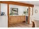 Stylish wet bar with sleek cabinetry and a wine cooler adjacent to the dining area at 6640 Kilimanjaro Dr, Evergreen, CO 80439