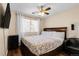 Relaxing bedroom with a comfortable bed, TV, and a window for natural light at 337 Ivory Cir, Aurora, CO 80011