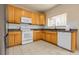 Functional kitchen with ample cabinet space, granite countertops, and modern appliances at 337 Ivory Cir, Aurora, CO 80011