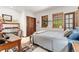 Bright bedroom featuring natural light, closet and desk at 6457 Willow Broom Trl, Littleton, CO 80125