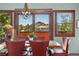Bright dining room offers scenic mountain views from the dining table at 6457 Willow Broom Trl, Littleton, CO 80125