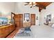 Bedroom featuring wood beam ceilings, terra cotta tile floor, and comfortable decor at 6457 Willow Broom Trl, Littleton, CO 80125