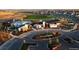 Beautiful aerial view of a community with a pool, clubhouse, green space, and many homes at 171 S Waterloo St, Aurora, CO 80018