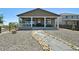 Charming home with a covered patio and landscaped backyard, perfect for outdoor living at 171 S Waterloo St, Aurora, CO 80018