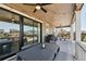 Spacious covered patio featuring outdoor dining area, ceiling fan and convenient access to the backyard at 171 S Waterloo St, Aurora, CO 80018