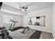 Spacious home gym featuring treadmill, weights, and a large mirror for workouts at 171 S Waterloo St, Aurora, CO 80018