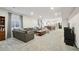Open-concept living room flows into dining area and kitchen, perfect for entertaining at 171 S Waterloo St, Aurora, CO 80018