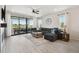 Bright living room with a large sectional sofa, big windows, and hardwood floors at 171 S Waterloo St, Aurora, CO 80018