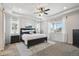 Serene main bedroom with tray ceilings, plush carpeting, and an abundance of natural light at 171 S Waterloo St, Aurora, CO 80018
