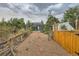 Pathway through backyard leading to garden and shed at 667 S Raleigh St, Denver, CO 80219