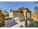 Gazebo with outdoor seating for relaxation, paired with a playhouse and a detached garage at 2901 N Glencoe St, Denver, CO 80207