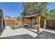 Relaxing backyard with a gazebo and outdoor seating area with a well-maintained lawn at 2901 N Glencoe St, Denver, CO 80207