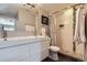 Stylish bathroom featuring a double sink vanity, a tiled shower, and modern finishes at 2901 N Glencoe St, Denver, CO 80207