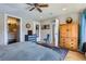 Spacious bedroom with hardwood floors, ample closet space, and a view into the bathroom at 2901 N Glencoe St, Denver, CO 80207