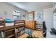 Bright bedroom featuring a wooden bunk bed, dresser with mirror, and a playful learning environment at 2901 N Glencoe St, Denver, CO 80207