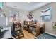 Cozy bedroom includes wooden bunk bed, study space with desk and chair, and playful decor at 2901 N Glencoe St, Denver, CO 80207