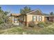 Charming brick home with well-maintained front yard and manicured landscaping at 2901 N Glencoe St, Denver, CO 80207