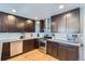 Well-appointed kitchen featuring stainless steel appliances and sleek dark cabinetry at 2901 N Glencoe St, Denver, CO 80207
